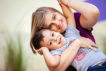 portrait of happy mother with her son outdoors