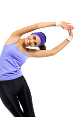 Fototapeta na wymiar smiling woman, in violet sportswear, doing stretching exercise or youga moves