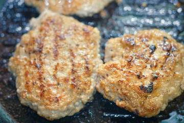 frying cutlets in a pan close-up
