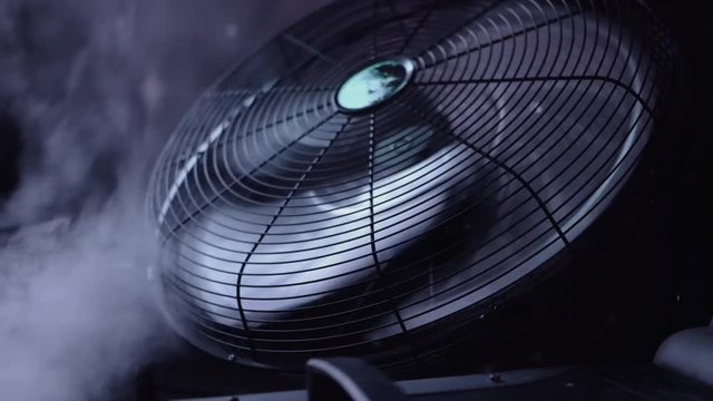 Fan blows smoke on the stage.