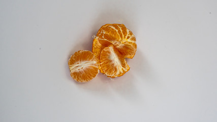 Ripe and fresh mandarin isolated on white background. Close-up, macro.