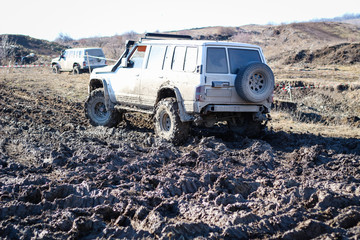 Ukrainian offroad competition in the city of Kamyanets Podilsky. Swamp and mud on cars. Produce large puddles