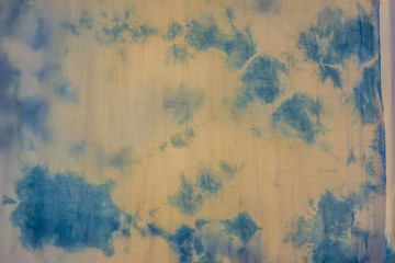 Beautiful patterned on Southern Thai style tie dyed garment and fabric for sale in night market at Bangkok, Thailand