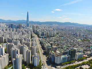 Aerial view cityscape of Seoul, South Korea. Aerial View Lotte tower at Jamsil.  View of Seoul with river and mountain. Seoul downtown city skyline, Aerial view of Seoul, South Korea, 08/20.2018