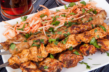 delicious grilled lamb shashlik with beer on the table