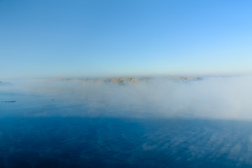 Fog over the water on a river Dnieper on autumn