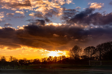dramatic sunset over soccer field