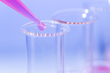 Test tube in rack and pipette media dispenser.