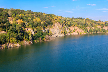 View of the lake at abandoned quarry on summer