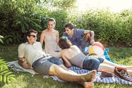 Young people relaxing on lawn 