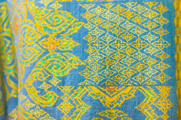 Beautiful patterned on the northeastern thai style garment, silk and clothing for sale at the local flea market.
