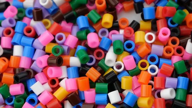 Colorful fusible plastic beads. Close up.