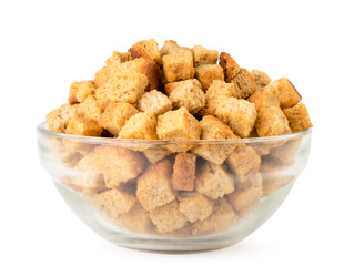 Crackers in a glass plate close-up on a white. Isolated.