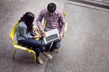 Elevated view of couple using laptop 