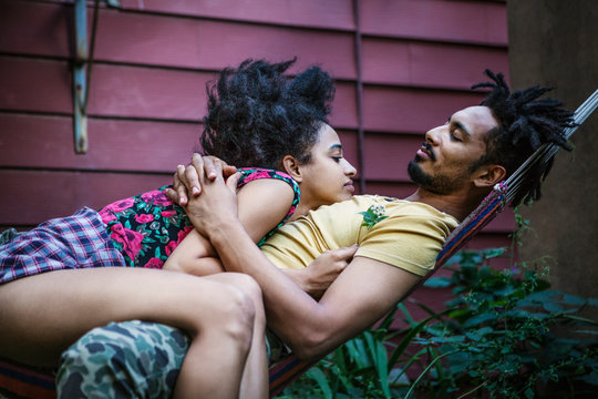 Couple in garden in hammock 