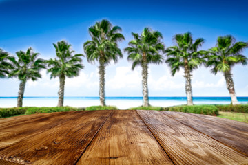 desk of free space and coco palms on beach 