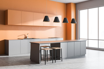Orange kitchen corner with bar