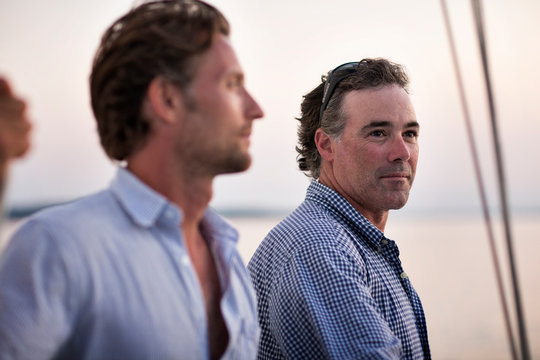 Two men relaxing on private yacht 