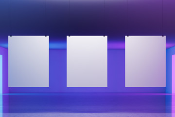 Three vertical posters on purple wall