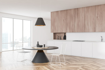 White kitchen corner with round table