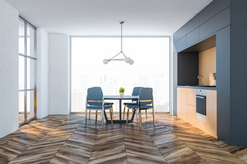 Gray and orange kitchen interior with table