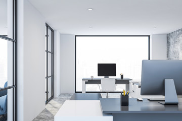 White office with gray tables