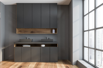 Gray and wooden bathroom with double sink