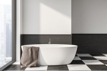 Obraz na płótnie Canvas White and gray bathroom interior with tub