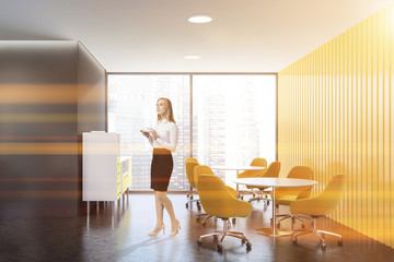 Woman in gray and yellow panoramic living room