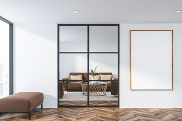 Living room with brown sofa and poster
