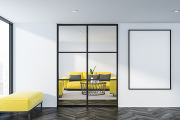 Living room with yellow sofa and poster