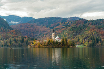 Fototapeta premium Beautiful autumn landscape around Lake Bled with Pilgrimage Church of the Assumption of Maria