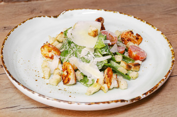 Shrimp Caesar salad with Parmesan cheese, croutons and lettuce