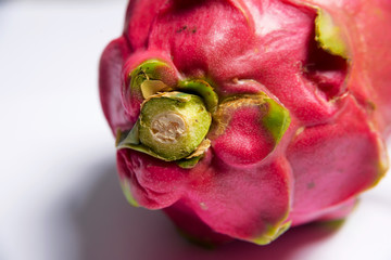 Exotic fruit. Dragon fruit. Red pitaya. Sweet pitahaya on white background. Cut the dragon fruit....