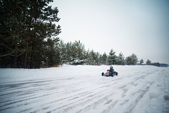 Go-cart driver on snowy road 