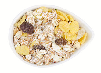Isolated muesli. Bowl of muesli isolated on white background with clipping path. Top view.
