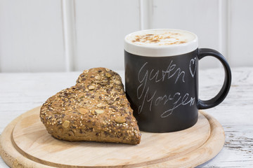Hearty breakfast scene with wholemeal roll