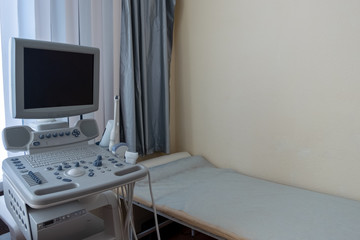 Cabinet ultrasound. Hospital equipment. Diagnosis and examination of human internal organs through a computer. Modern methods of medical research. Copy space.