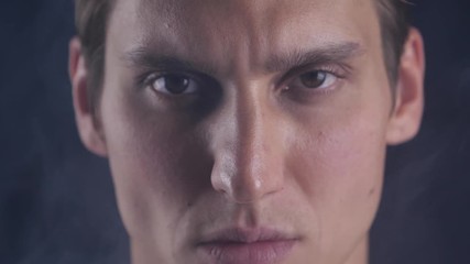 Focused glance. Male looks at camera isolate. Man looks handsome and cool. Guy concentrated focused looking forward. Closeup