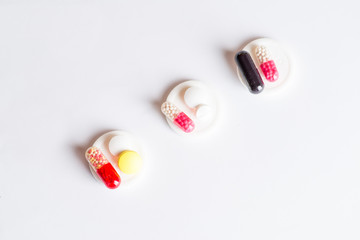 doses of different tablets divided into piles