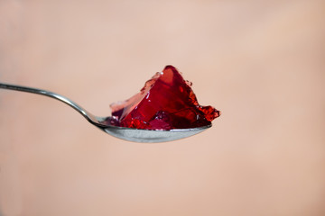 macro red jelly on spoon 