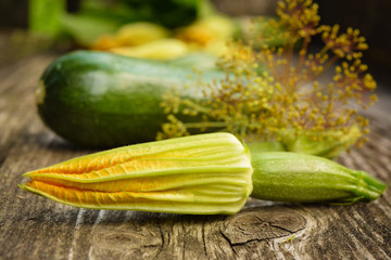 zucchini flowers, zucchini with dill  on wooden table , close up – Image