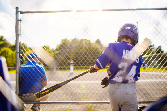 Young baseball player practicing before match 