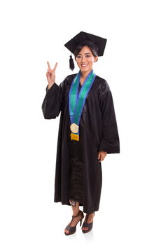 Graduating girl peace sign full body over white background