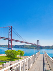 Lisbon, Portugal-October 17, 2017: Landmark suspension 25 of April bridge over Tagus River in Lisbon
