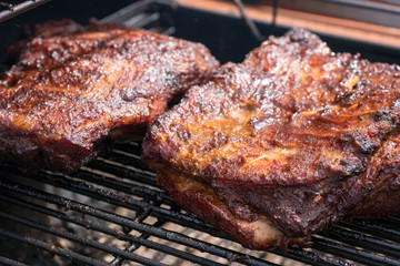 Grilled pork ribs on the grill. Summer outdoor