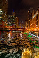 Chicago Riverwalk with big chunks of ice floating in the river after cold days, Chicago IL 2019