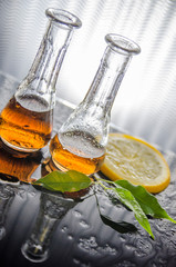 Two glasses of whiskey with lemon slice