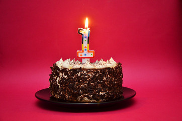 Cake for first birthday, number one made of sugar on top with stars around it.