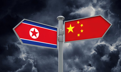 China and North Korea flag sign moving in different direction. 3D Rendering